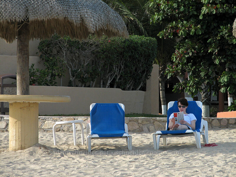 crossword puzzles under a palapa [El Presidente Hotel, San Jose del Cabo, Los Cabos, Baja California Sur, Mexico]