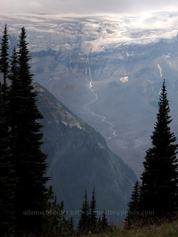 glacial waterfall below clouds [Sourdough Ridge Trail, Mount Rainier National Park, Pierce County, Washington]